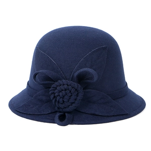 Detailed view of dark blue wool felt hat featuring exquisite 3D woven flower decoration