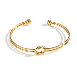 Minimalist knot cuff bracelet in 18K gold plated stainless steel with an open-ended design