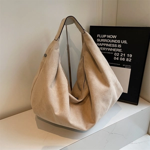 Minimalist beige matte suede hobo bag with large capacity and elegant shoulder strap