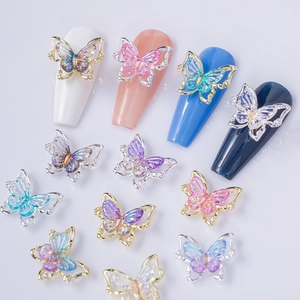 Iridescent laser butterfly nail charms with gold and silver metal frames for manicure