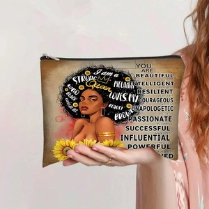 Detail of canvas makeup bag featuring sunflower design and 'I am a STRONG Queen' quote