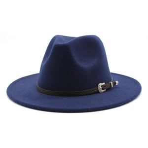 Close-up of navy wool jazz hat with a brown leather belt and vintage silver buckle