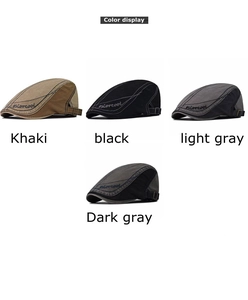 Detail view of cotton beret hats in khaki, black, and gray with side adjustment buckles