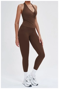 Detail view of chocolate brown halter neck yoga top and high waist leggings set