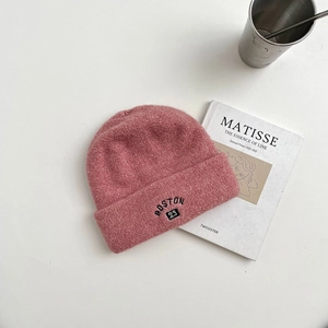 Detail of pink wool knit beanie with black BOSTON 23 embroidery and folded cuff style