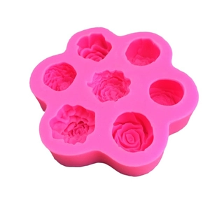 Pink silicone mold featuring 7 detailed rose shapes for cake decorating and DIY baking