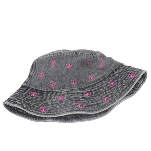 Close-up detail of a gray denim bucket hat with pink butterfly embroidery accents