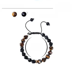 Detail showing 10mm tiger eye and black matte stone beads with woven drawstring