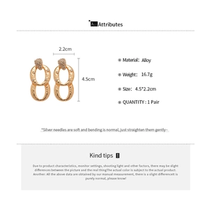 Detailed size chart for gold-tone oval textured drop earrings with zircon inlays