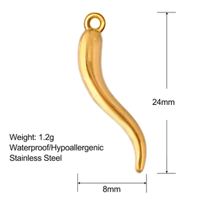 Macro view of gold stainless steel horn pendant with dimensions 24mm by 8mm