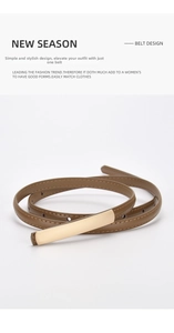 Detail of slim brown leather belt for women featuring a minimalist gold rectangular buckle