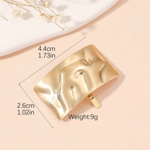 Golden wavy textured metal ponytail clip with 4.4cm length for minimalist hair styling