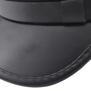 Macro detail of black PU leather flat cap showing premium stitching and decorative strap