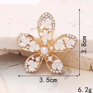Golden five-petal flower accessory with pearls and crystals measuring 3.8cm by 3.5cm