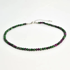 Detail of 4mm natural stone beaded necklace featuring green and ruby zoisite colors