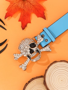 Detailed close-up of a blue punk belt featuring a silver skull buckle with rhinestones