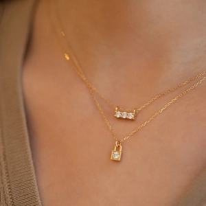Double-layered 925 silver 18K gold necklace with zircon lock pendant and triple stone bar