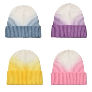Women's gradient knit beanie hats in blue, purple, yellow, and pink for winter warmth