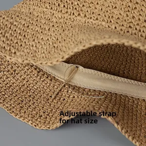 Close-up of the internal adjustable drawstring ribbon inside the straw sun hat