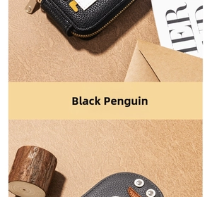 Detailed view of cute black penguin card holder made of premium litchi grain leather