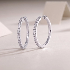 Close-up of S925 hallmark on a double-row moissanite silver hoop earring detail