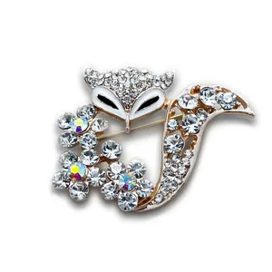Elegant fox brooch with gold plating, white enamel face and sparkling crystals