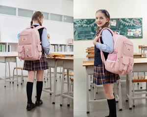 Pink multi-pocket student backpack with cartoon badges shown in a classroom setting