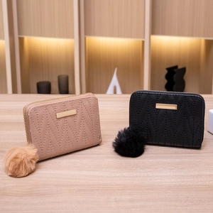 Mini faux leather coin purses in pink and black with V-stitch and plush ball keychain
