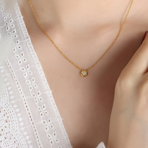 Elegant gold hexagon pendant necklace featuring a brilliant round zircon on a thin chain