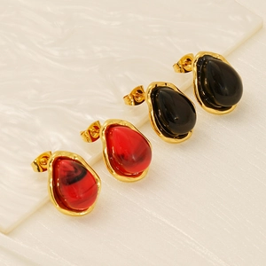 Irregular resin geometric stud earrings in marble red and solid black with gold finish