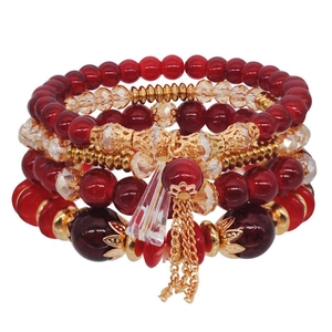 Bohemian stacked multi-layer beaded bracelet set with red crystals and gold metal charms