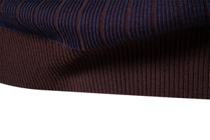 Close-up of ribbed knit cuffs and striped pattern on men's high-quality sweater