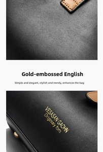 Close-up of black lychee leather handbag with gold foil lettering and fine stitching detail