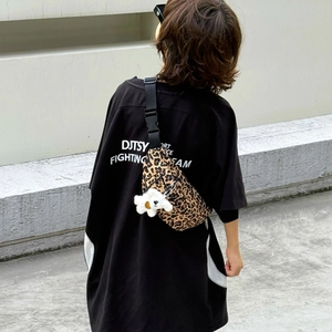 Kids leopard print canvas chest bag with white plush charm and adjustable strap
