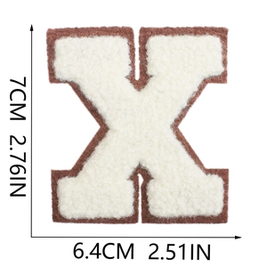 Detail of 7cm letter X chenille patch with brown border and cream fleece surface