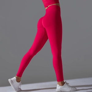 Detail view of pink high-waist seamless leggings with body-shaping and lifting effect