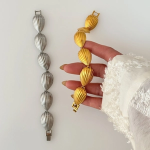 18k gold plated stainless steel shell textured link bracelet in gold and silver finish