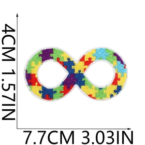 Macro detail of infinity puzzle embroidery patch showing precise dimensions and colorful stitching
