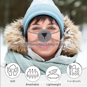Detail of handmade grey crochet nose warmer with soft wool and animal nose pattern
