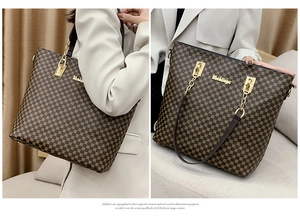 Detail of a brown geometric grid tote bag with metal logo and chain leather strap
