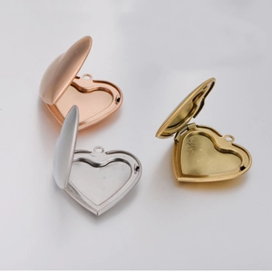 Three polished stainless steel heart lockets in silver, rose gold, and bronze open view