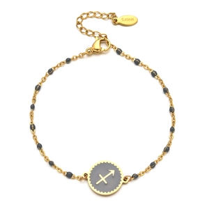 Detail view of gold stainless steel Sagittarius zodiac bracelet with grey enamel charm