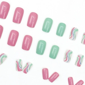 Pink and mint green press-on nails with ripple patterns and glossy square finish