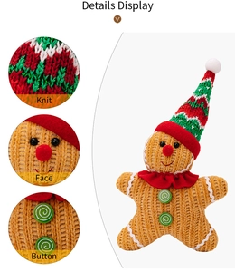 Detail view of knitted gingerbread man hanging ornament showing texture and button details