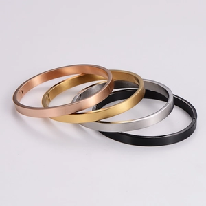 Sleek matte stainless steel bangles in rose gold, gold, silver, and black finishes
