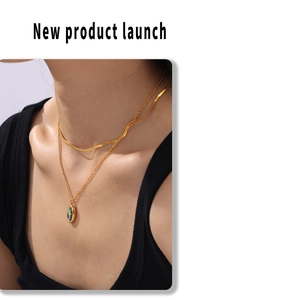 Double-layered gold titanium necklace with blue oval enamel pendant and snake chain