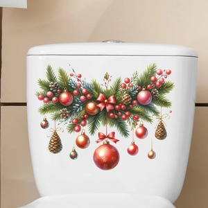 Macro detail of Christmas pine wreath sticker with red ornaments on toilet tank