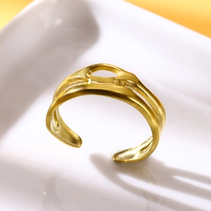 Detail of gold-plated double-layer hollow ring with oval cutout and adjustable opening