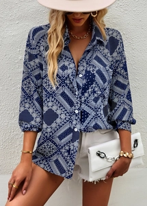 Detail of blue paisley print blouse with V-neckline and button-down front on a model