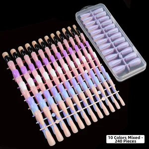 Macro detail of 240 piece stiletto fake nail set with 10 mixed colors in a clear box